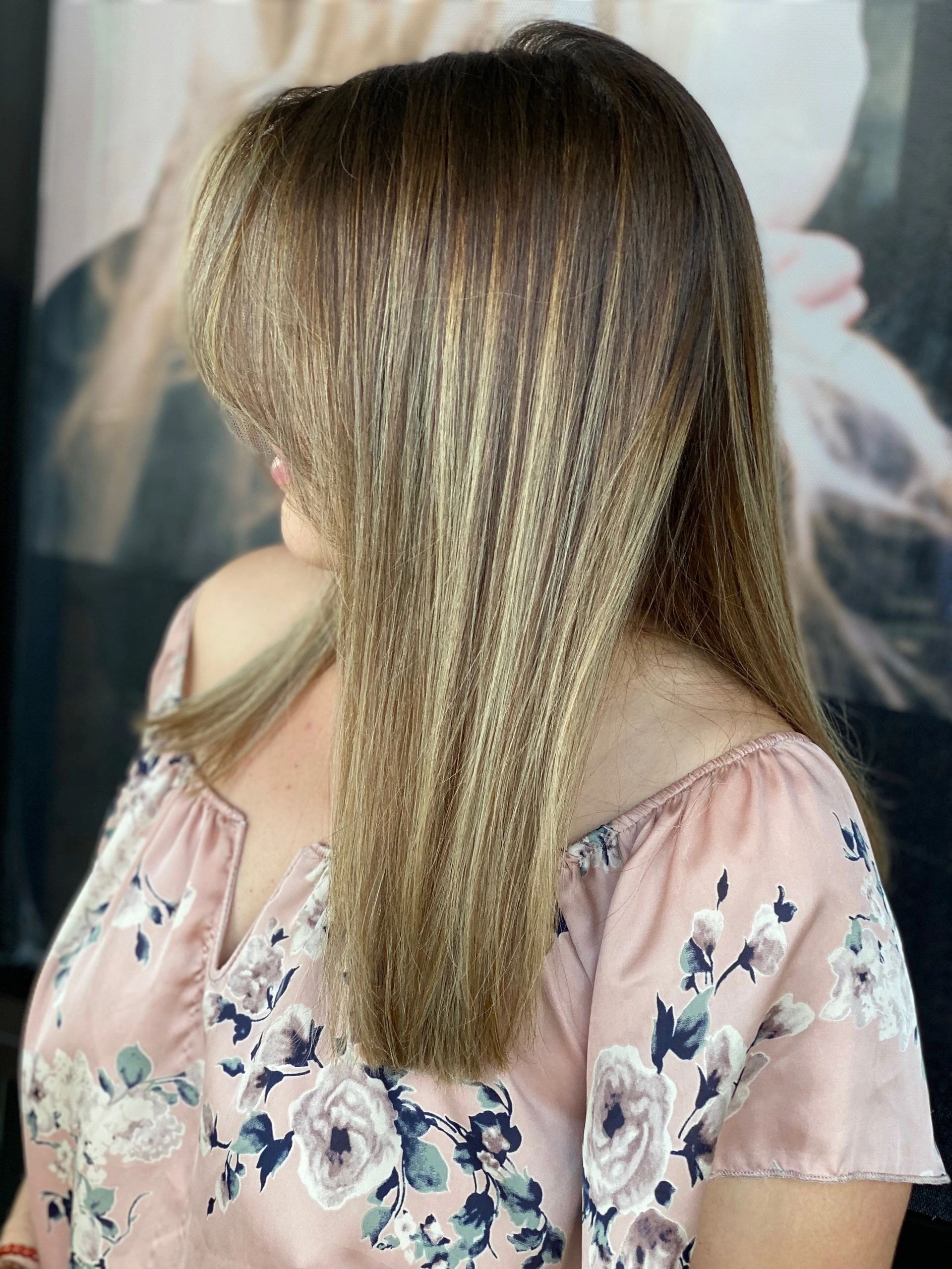 Salon client with freshly styled blonde hair